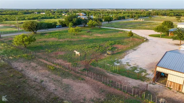 a view of a lake with a yard