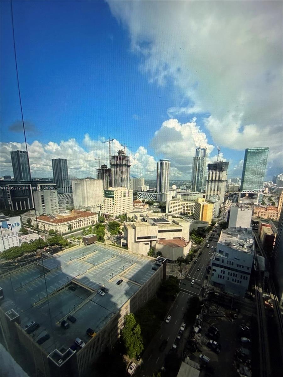 133 Northeast 2nd Avenue, Unit 2611 Miami, FL 33132 - Photo 6 of 15 a view of a living room and kitchen