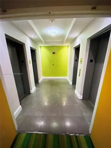 a view of a hallway with a window