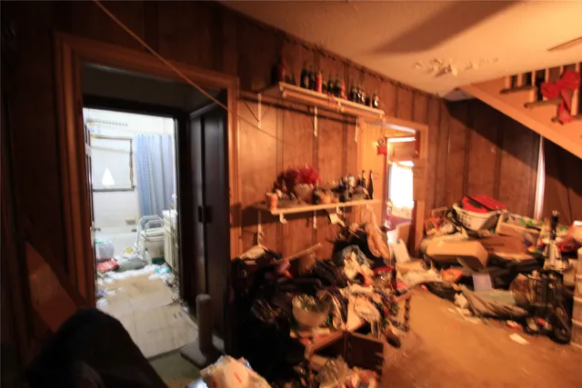 a view of gym equipment and living room with furniture
