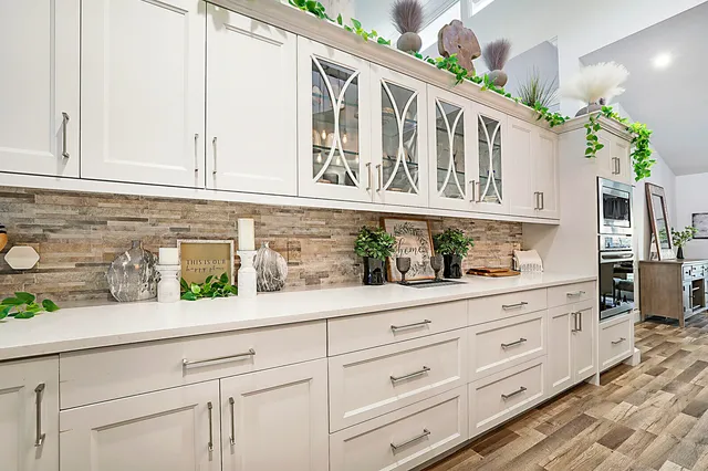 a white bath tub sitting in a bathroom next to a tub