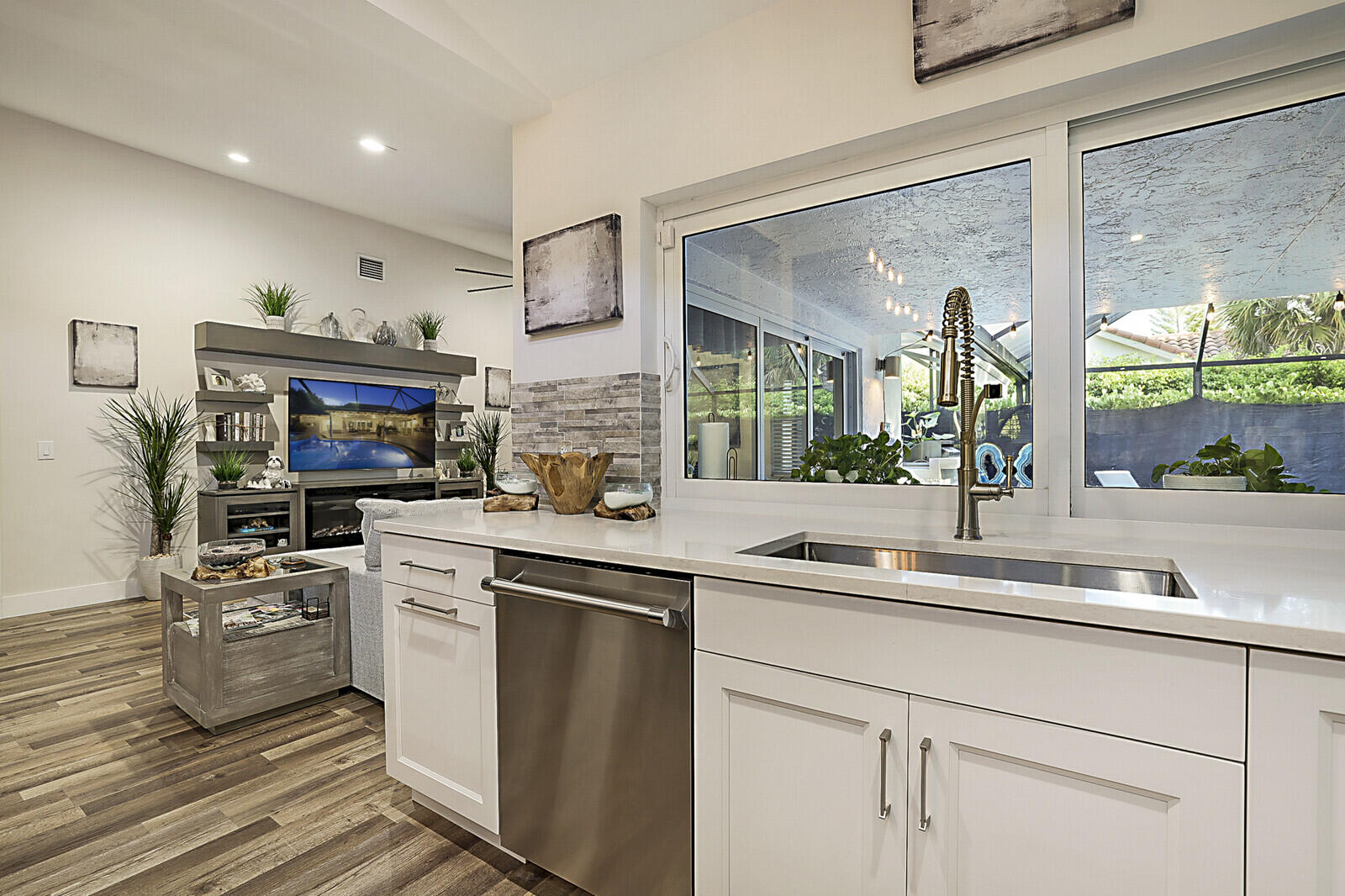 2155 Rabbit Hollowe Circle Delray Beach, FL 33445 - Photo 18 of 71 a kitchen with stainless steel appliances granite countertop a sink a stove and a refrigerator