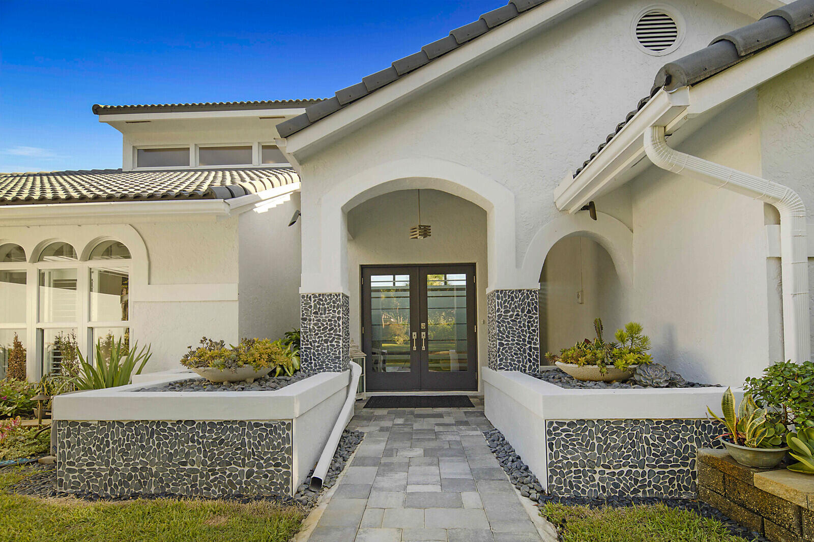 2155 Rabbit Hollowe Circle Delray Beach, FL 33445 - Photo 2 of 71 a front view of a house