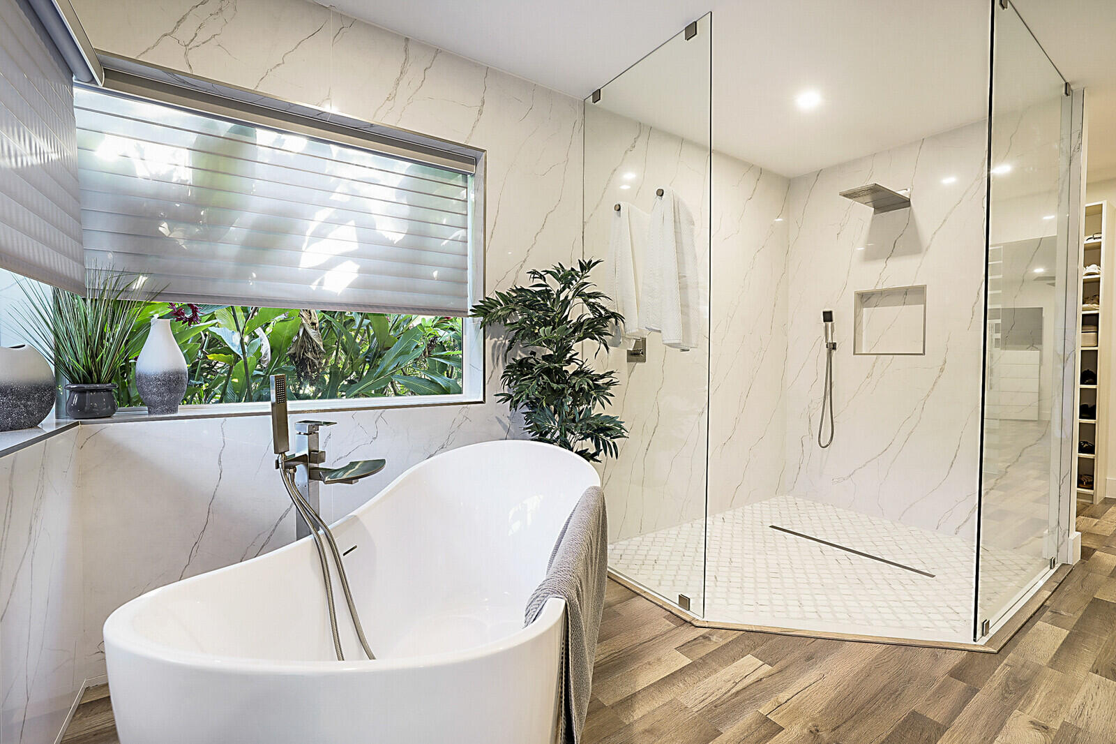 2155 Rabbit Hollowe Circle Delray Beach, FL 33445 - Photo 29 of 71 a white bath tub sitting in a bathroom next to a tub