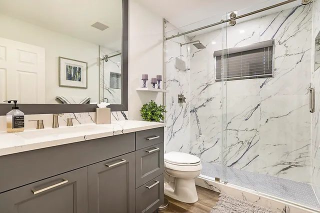 a view of a patio with table and chairs potted plants