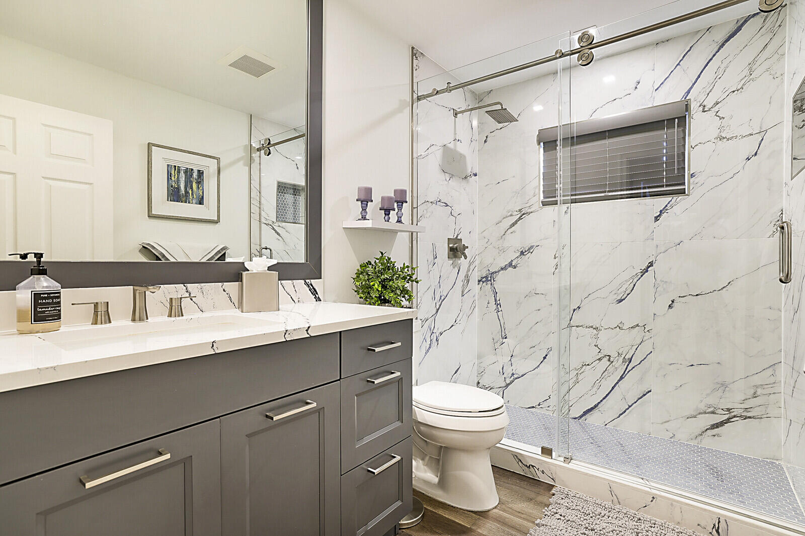 2155 Rabbit Hollowe Circle Delray Beach, FL 33445 - Photo 31 of 71 a bathroom with a sink toilet and shower