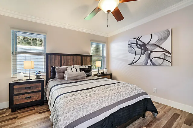 a view of white and white house with a big yard