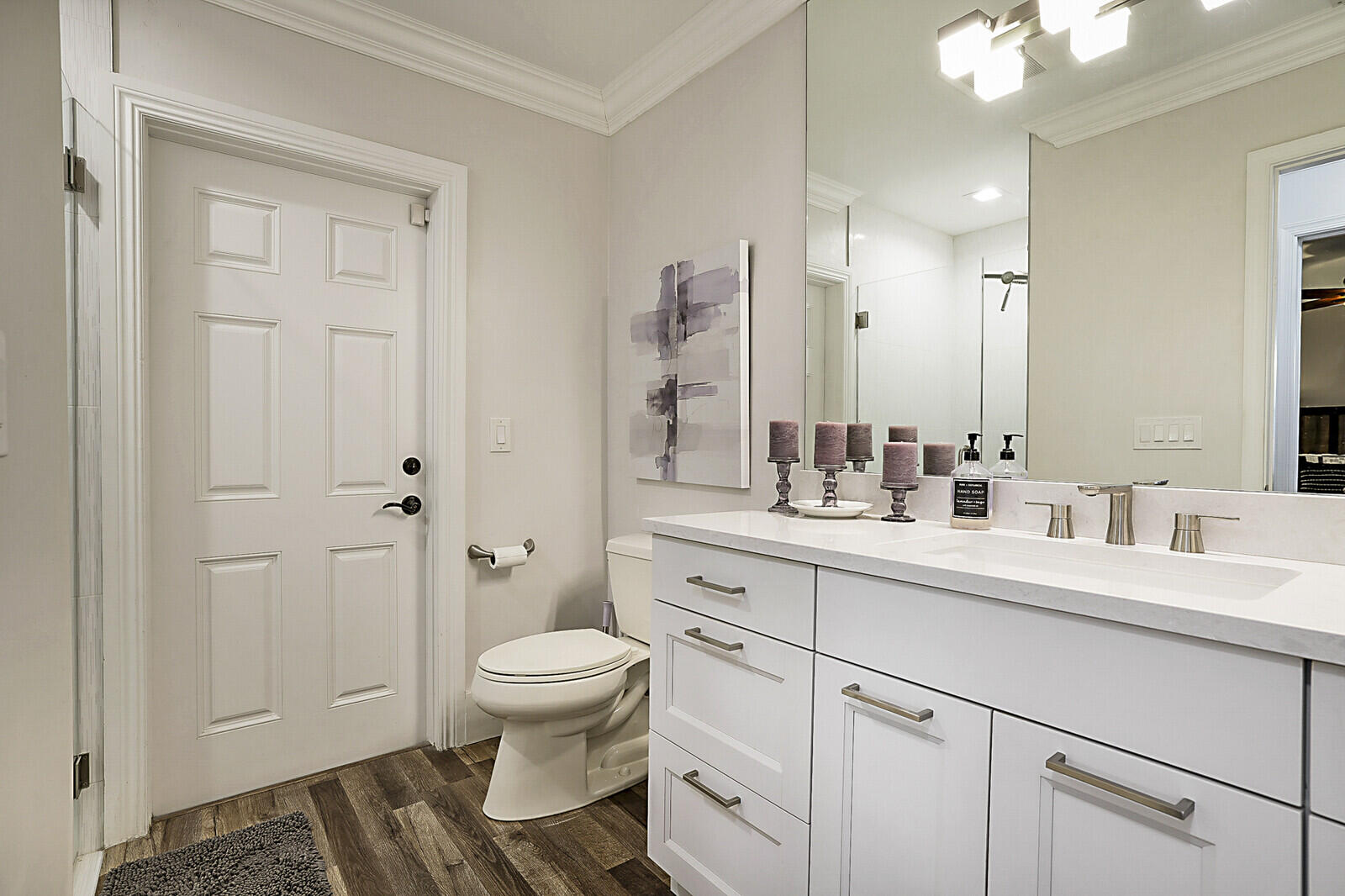 2155 Rabbit Hollowe Circle Delray Beach, FL 33445 - Photo 36 of 71 a bathroom with a sink a toilet and large mirror