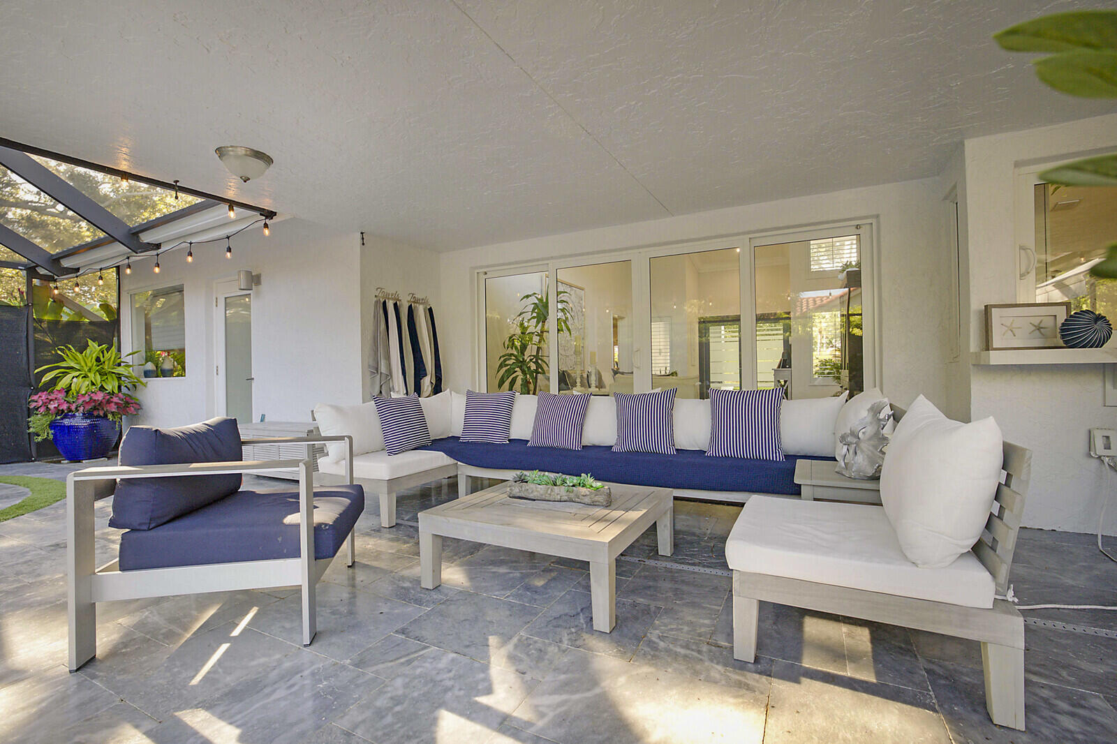 2155 Rabbit Hollowe Circle Delray Beach, FL 33445 - Photo 44 of 71 a living room with furniture potted plant and a window