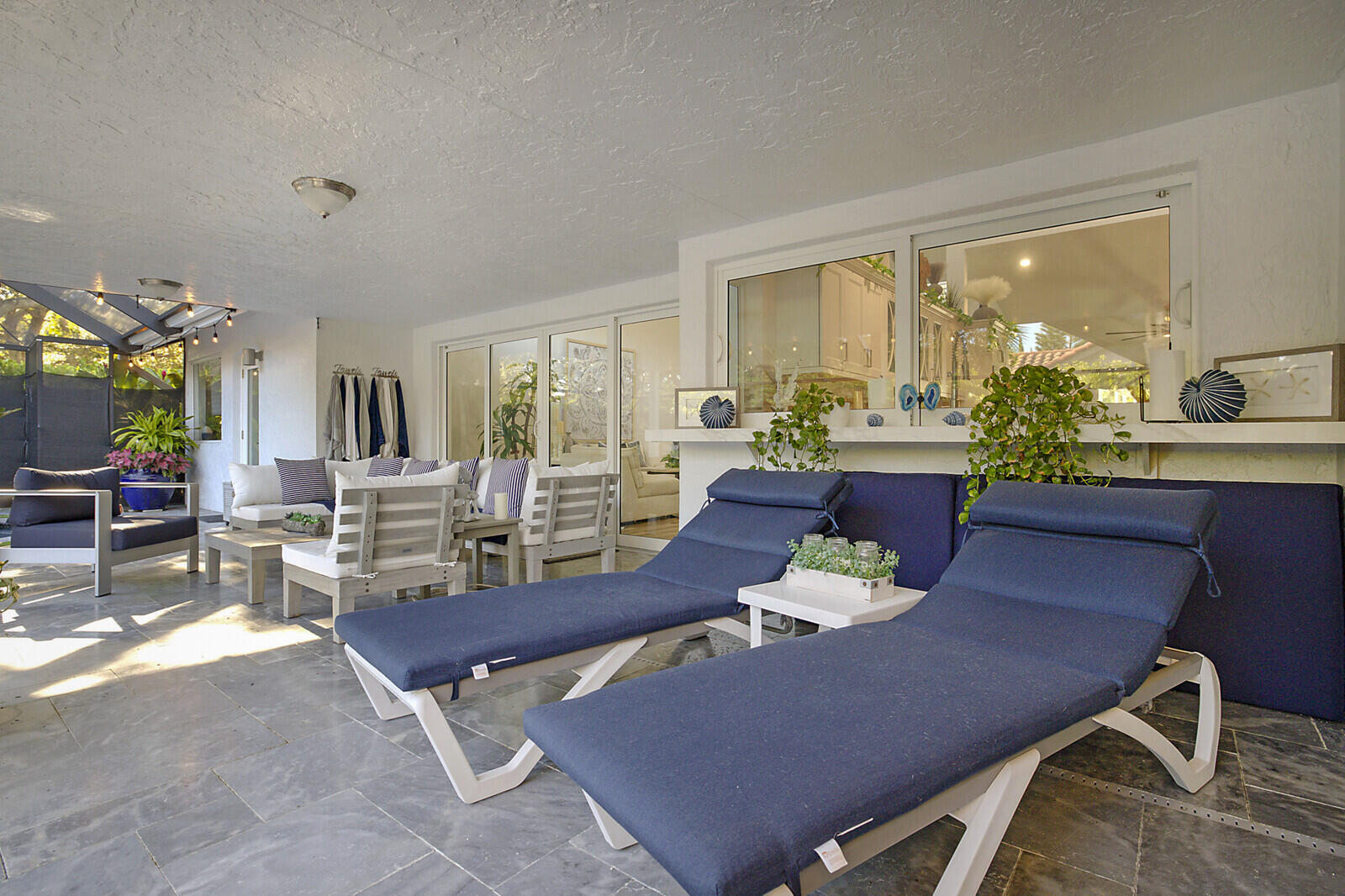 2155 Rabbit Hollowe Circle Delray Beach, FL 33445 - Photo 45 of 71 a living room with furniture and large windows