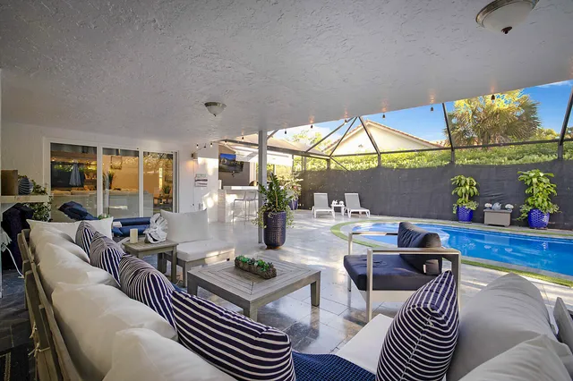 a front view of a house with yard and green space