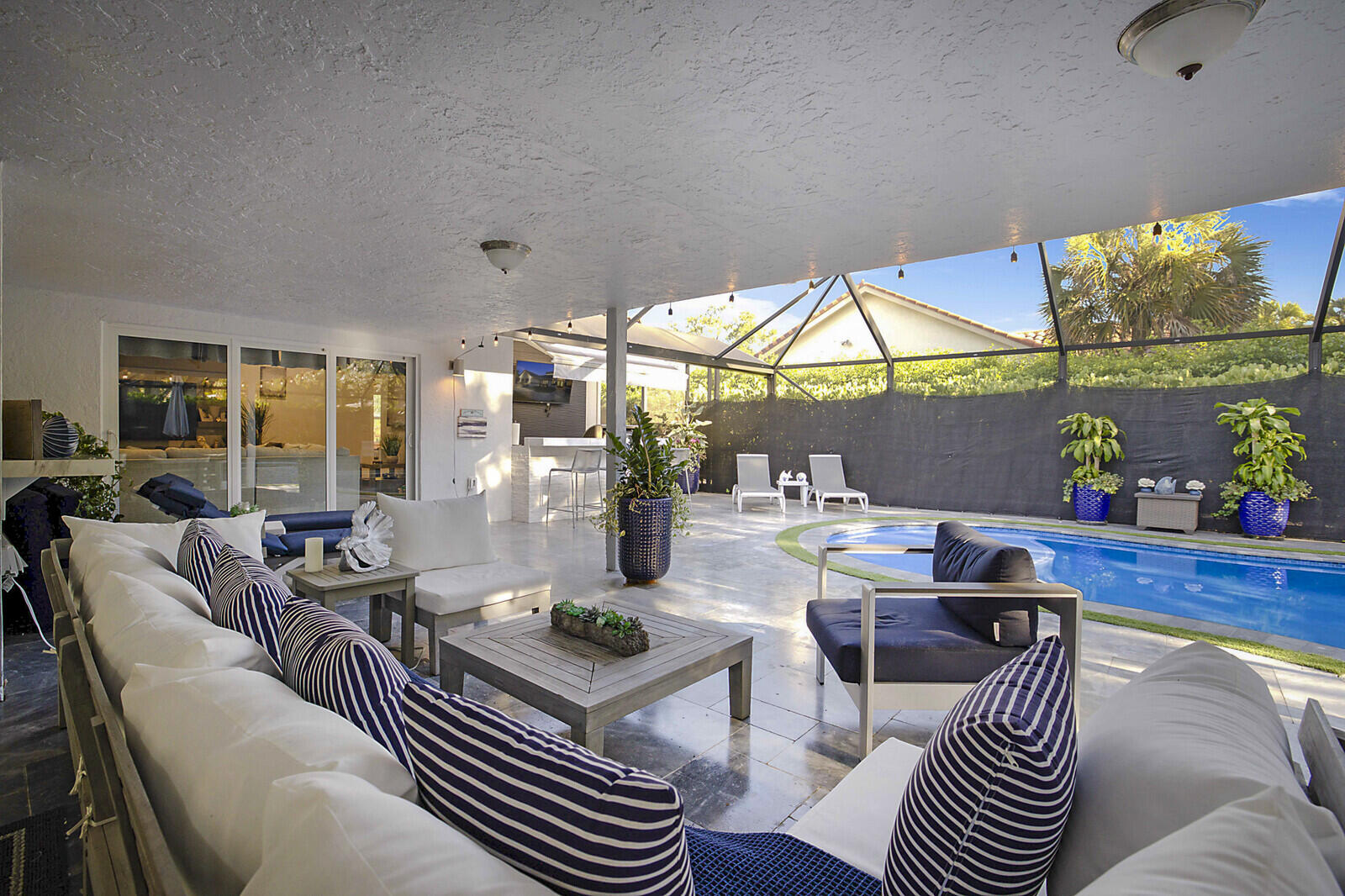 2155 Rabbit Hollowe Circle Delray Beach, FL 33445 - Photo 47 of 71 a living room with furniture a window and a table