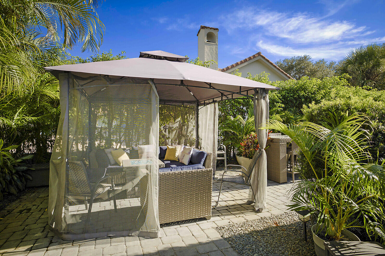 2155 Rabbit Hollowe Circle Delray Beach, FL 33445 - Photo 48 of 71 a view of a patio with table and chairs potted plants
