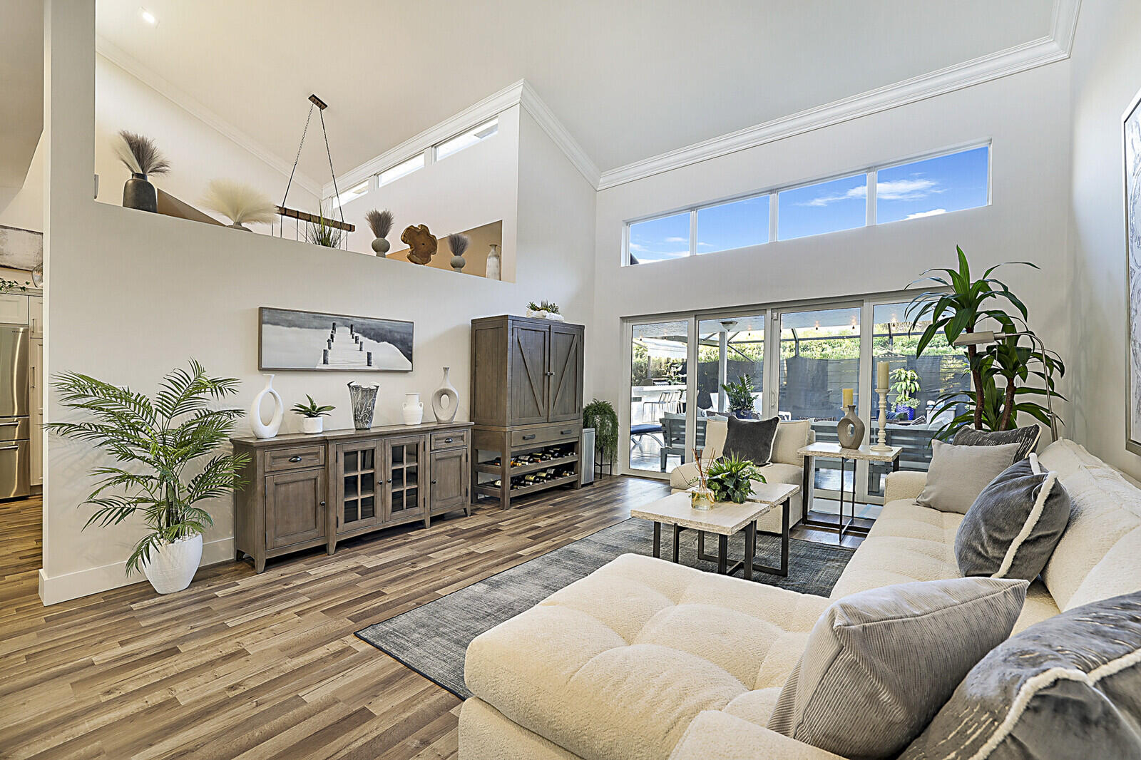 2155 Rabbit Hollowe Circle Delray Beach, FL 33445 - Photo 5 of 71 a living room with furniture kitchen view and a large window