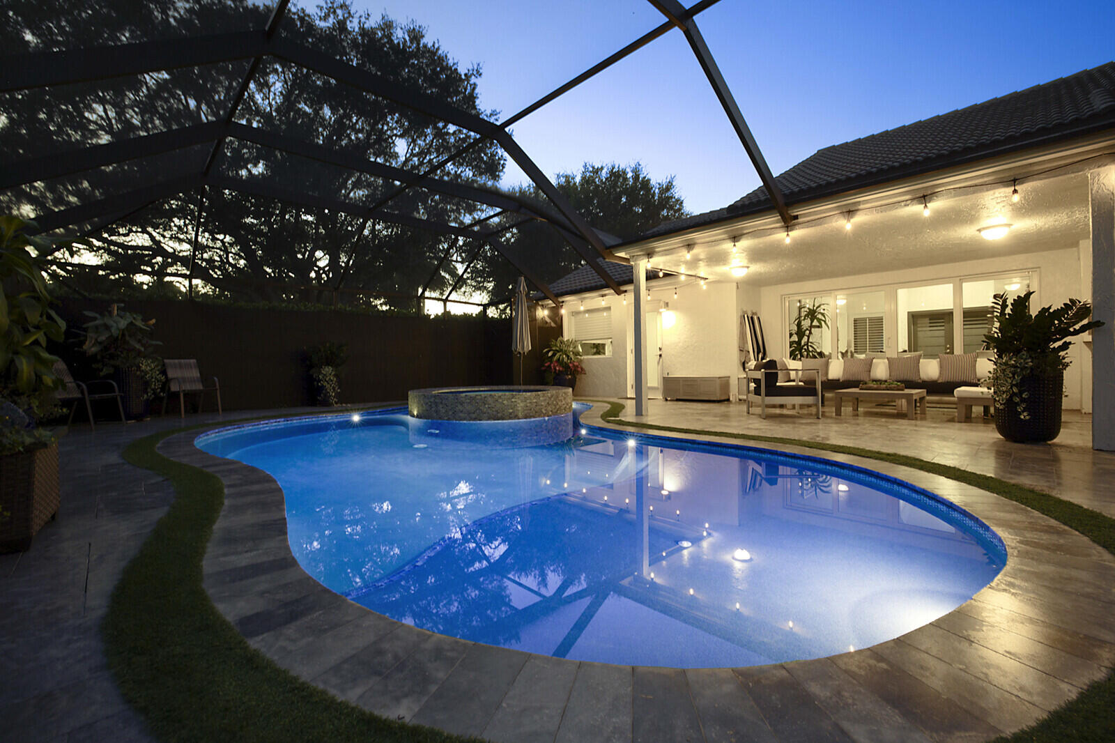 2155 Rabbit Hollowe Circle Delray Beach, FL 33445 - Photo 57 of 71 a view of a swimming pool with a sitting space