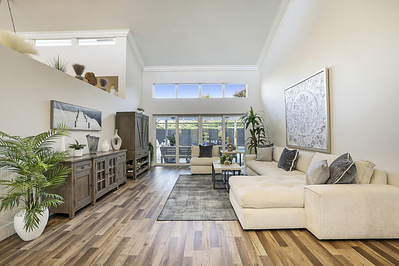 2155 Rabbit Hollowe Circle Delray Beach, FL 33445 - Photo 6 of 71 a living room with furniture and a large window