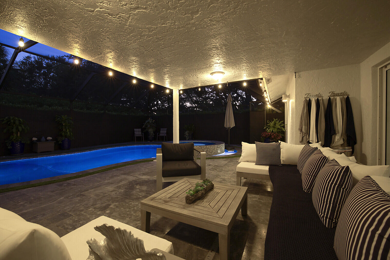 2155 Rabbit Hollowe Circle Delray Beach, FL 33445 - Photo 61 of 71 a living room with furniture and a flat screen tv