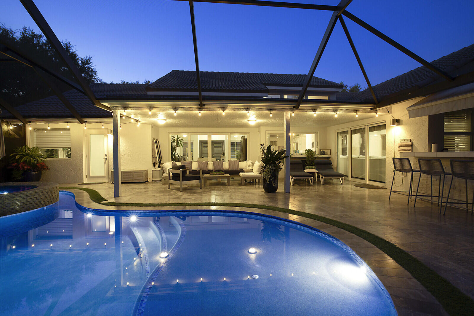 2155 Rabbit Hollowe Circle Delray Beach, FL 33445 - Photo 62 of 71 a view of a swimming pool with outdoor seating