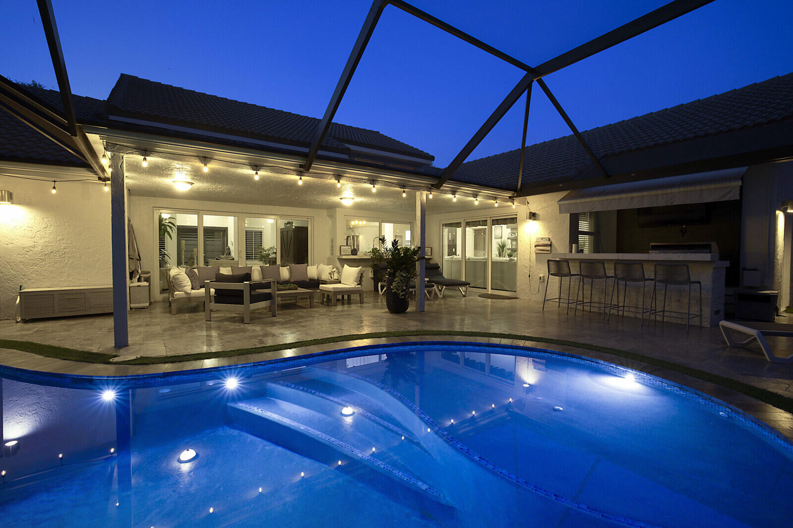 2155 Rabbit Hollowe Circle Delray Beach, FL 33445 - Photo 63 of 71 a view of a swimming pool with outdoor seating