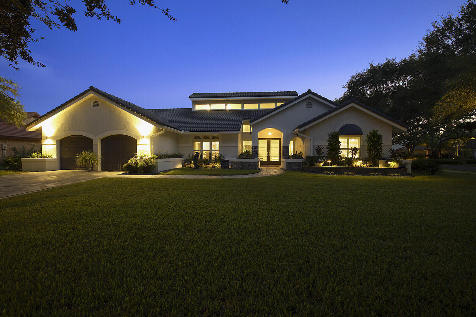 2155 Rabbit Hollowe Circle Delray Beach, FL 33445 - Photo 66 of 71 a front view of a house with a yard