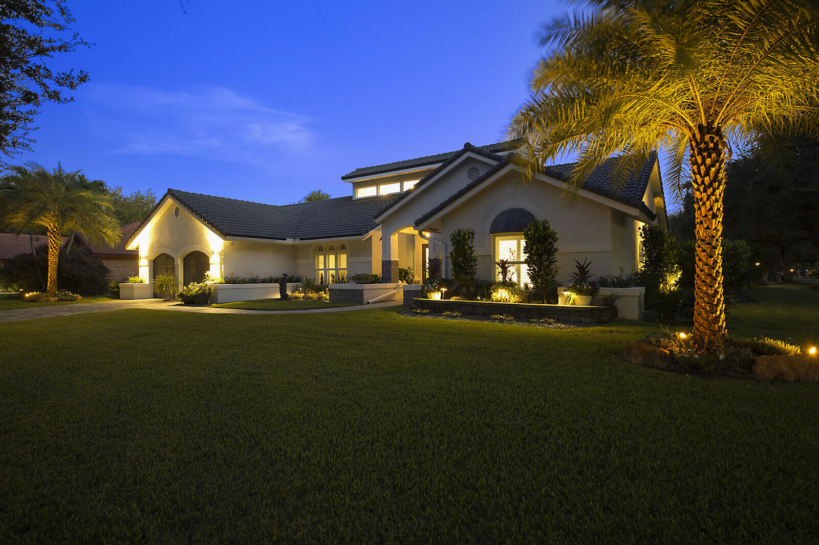 2155 Rabbit Hollowe Circle Delray Beach, FL 33445 - Photo 67 of 71 a front view of a house with a yard