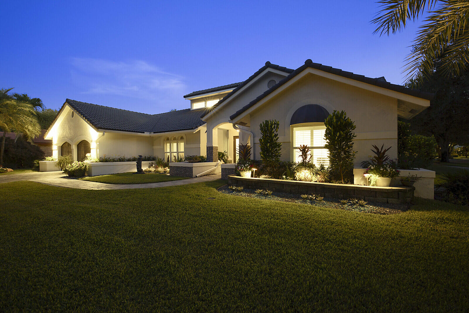 2155 Rabbit Hollowe Circle Delray Beach, FL 33445 - Photo 69 of 71 a front view of a house with a garden
