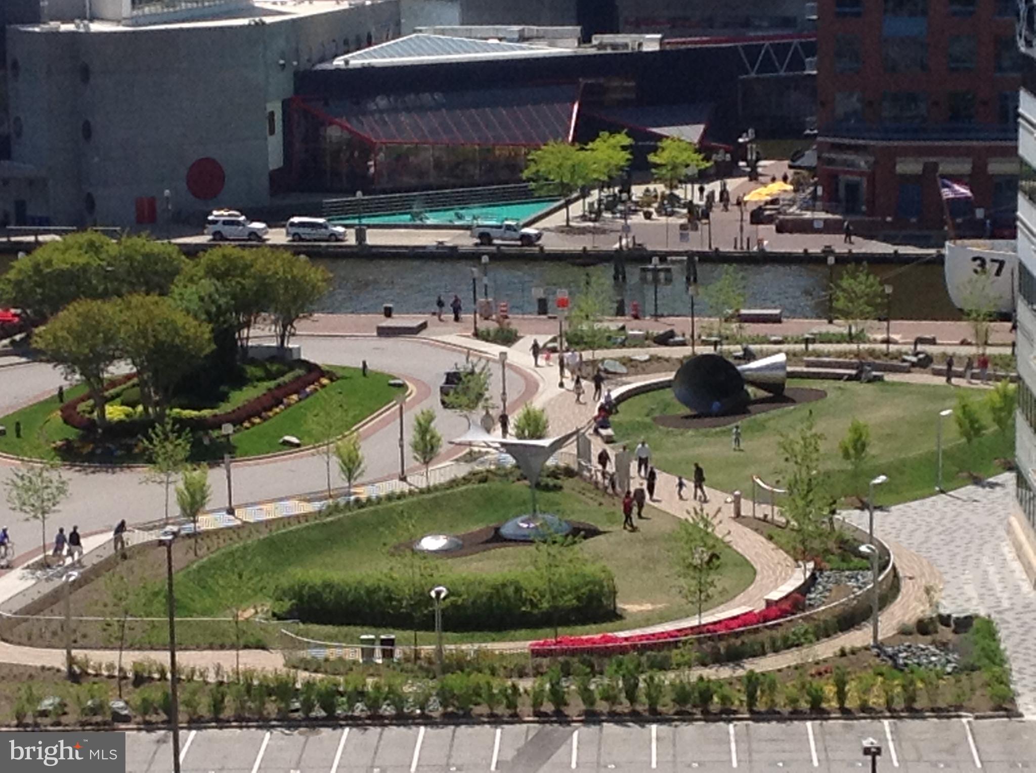 250 President Street, Unit 609 Baltimore, MD 21202 - Photo 25 of 28 Urban park bustling with life and greenery.
