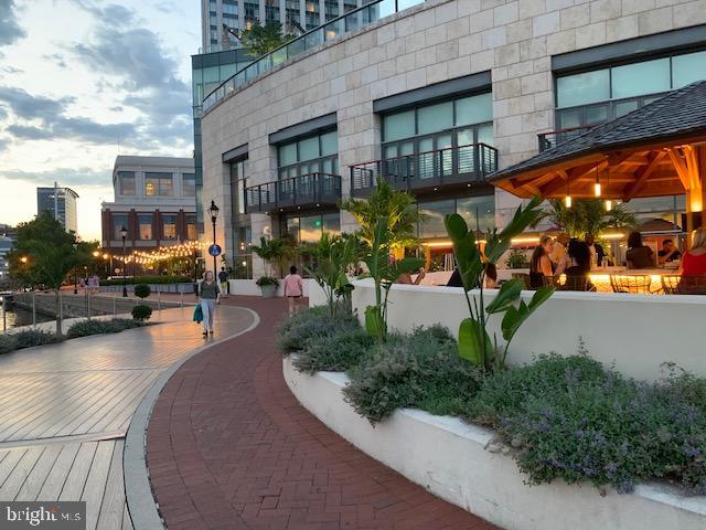 250 President Street, Unit 609 Baltimore, MD 21202 - Photo 26 of 28 Charming waterfront dining at dusk.