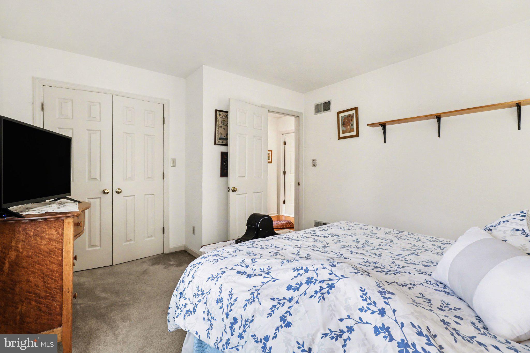 1014 Shadowstone Drive Lancaster, PA 17603 - Photo 27 of 54 a bedroom with a bed and a flat screen tv