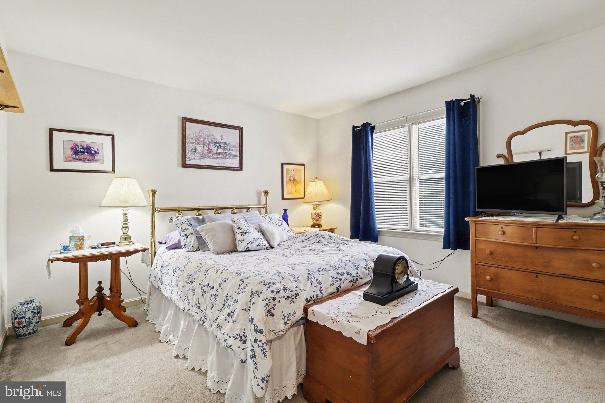 1014 Shadowstone Drive Lancaster, PA 17603 - Photo 36 of 54 a bedroom with a bed and a flat screen tv