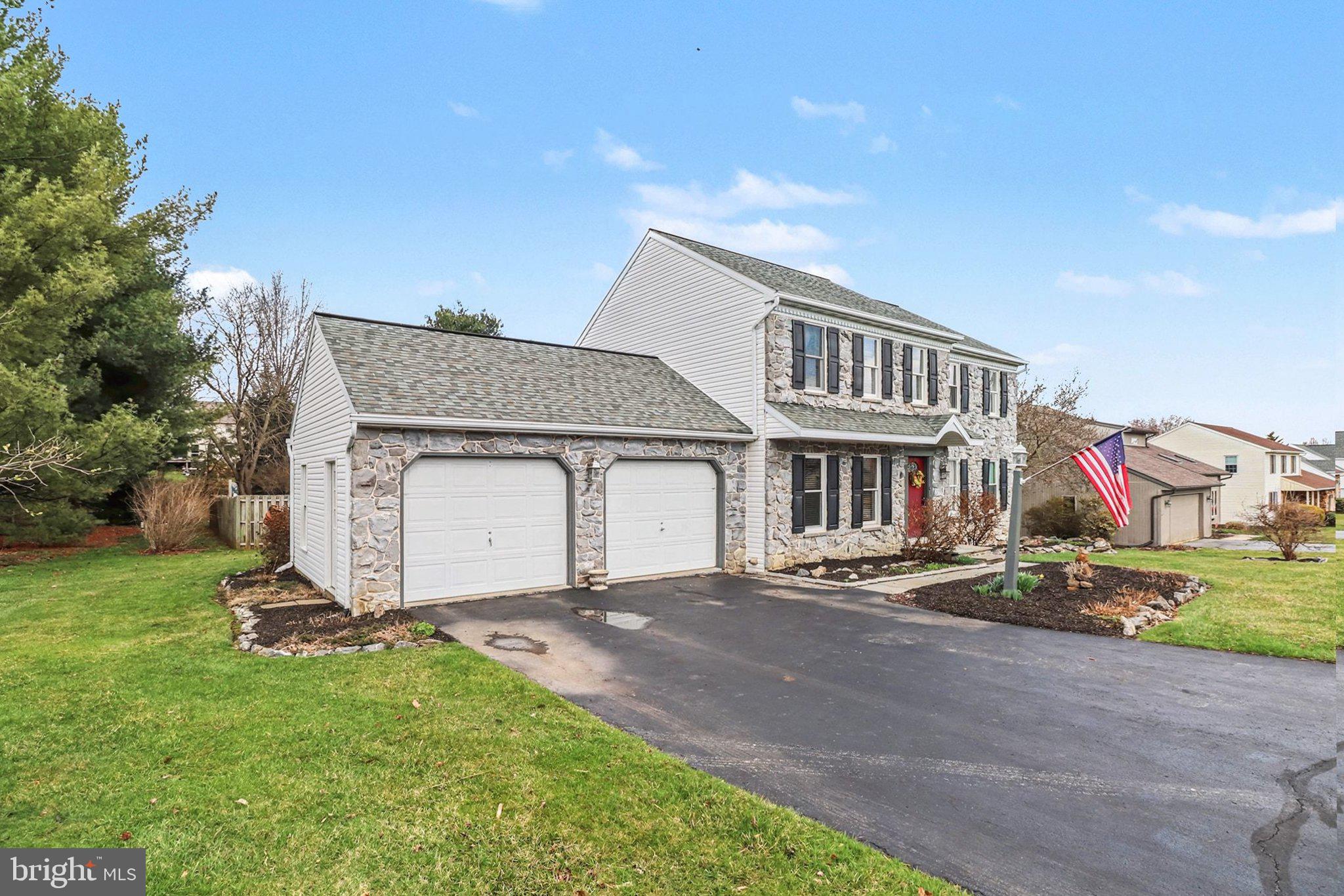 1014 Shadowstone Drive Lancaster, PA 17603 - Photo 4 of 54 a front view of a house with a yard