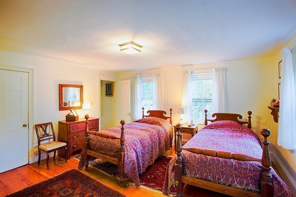 938 Bay Road Hamilton, MA 01982 - Photo 22 of 30 a bedroom with two beds and chair