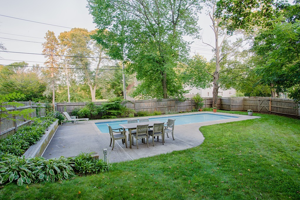 938 Bay Road Hamilton, MA 01982 - Photo 29 of 30 a view of a patio with table and chairs potted plants and large tree