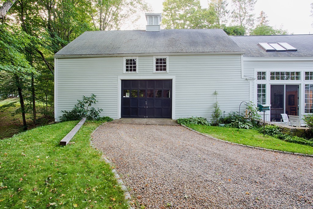 938 Bay Road Hamilton, MA 01982 - Photo 3 of 30 a front view of a house with garden