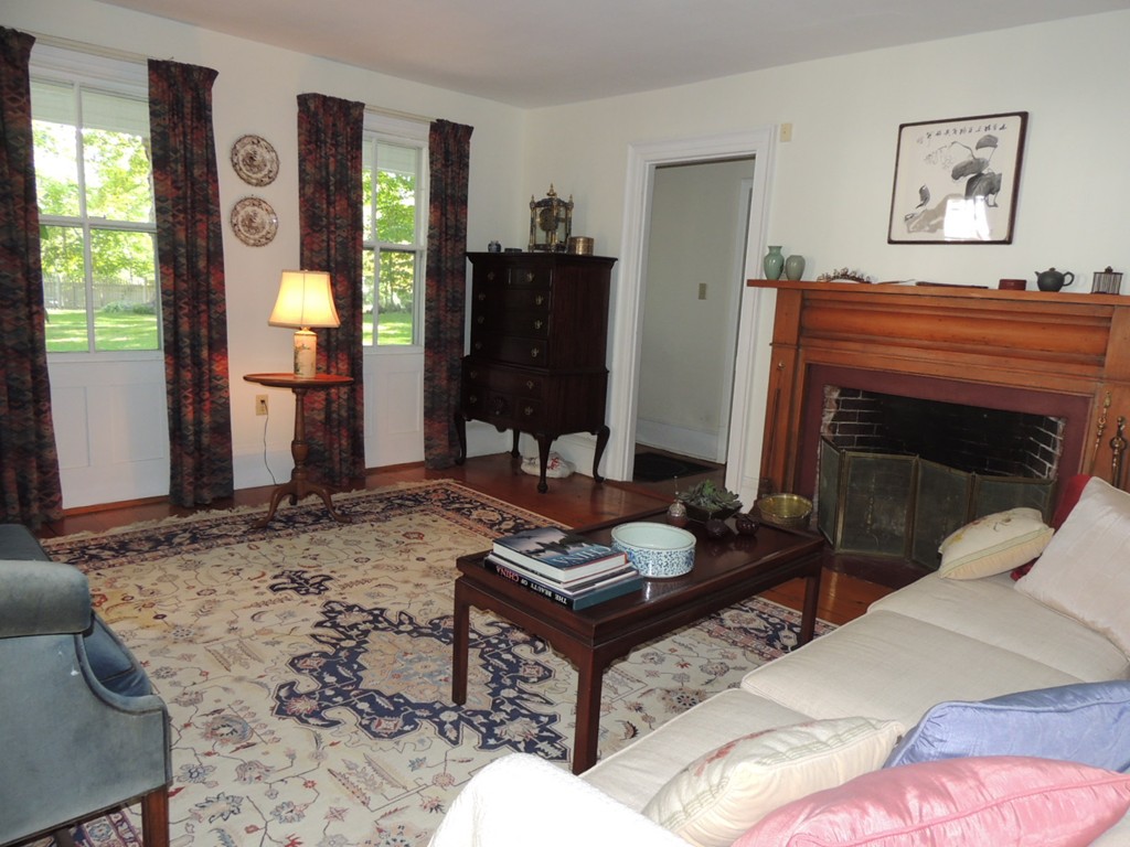 938 Bay Road Hamilton, MA 01982 - Photo 4 of 30 a living room with furniture and a fireplace