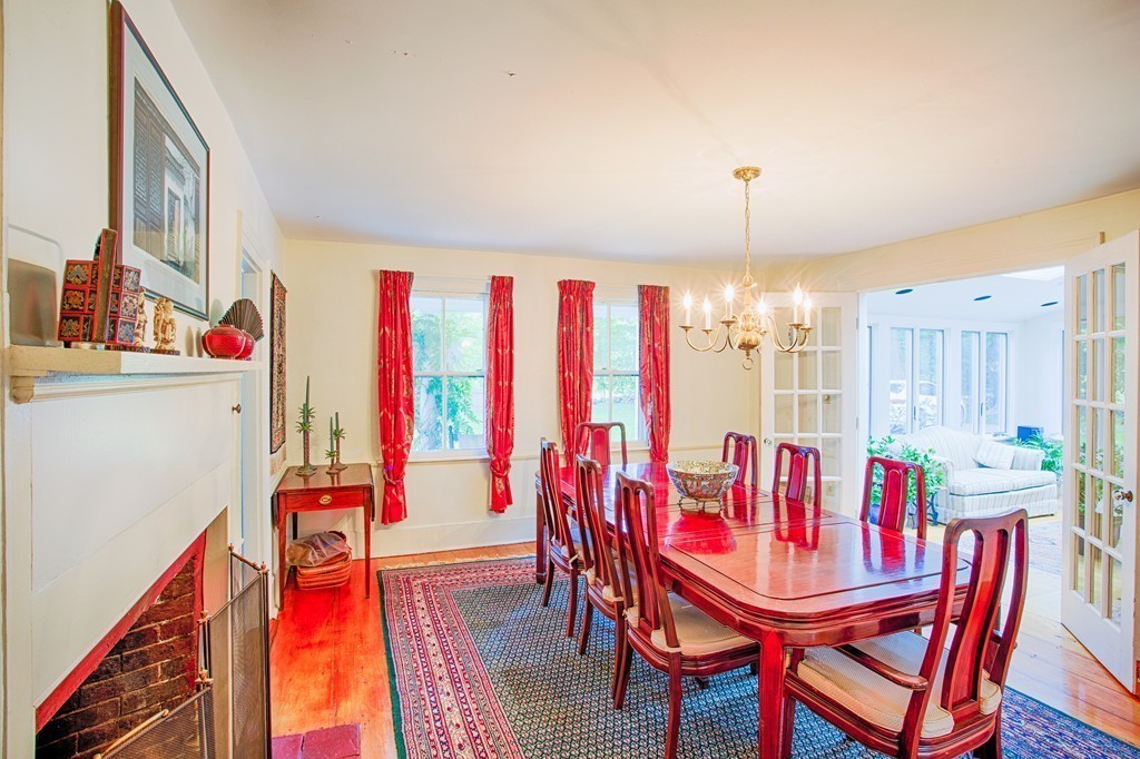 938 Bay Road Hamilton, MA 01982 - Photo 6 of 30 a view of a dining room with furniture and wooden floor