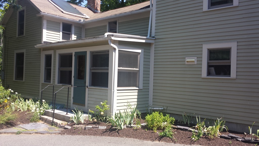 35 Pelham Road Amherst, MA 01002 - Photo 4 of 20 a front view of a house with a yard
