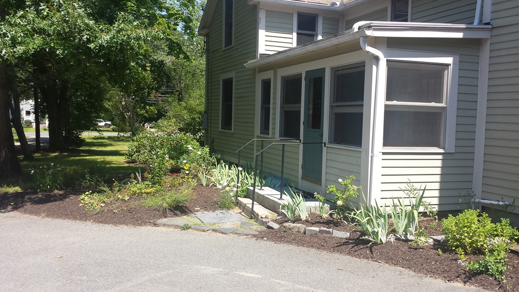 35 Pelham Road Amherst, MA 01002 - Photo 5 of 20 a view of a house with a yard and a fountain