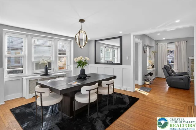 a view of a dining room with furniture window and wooden floor