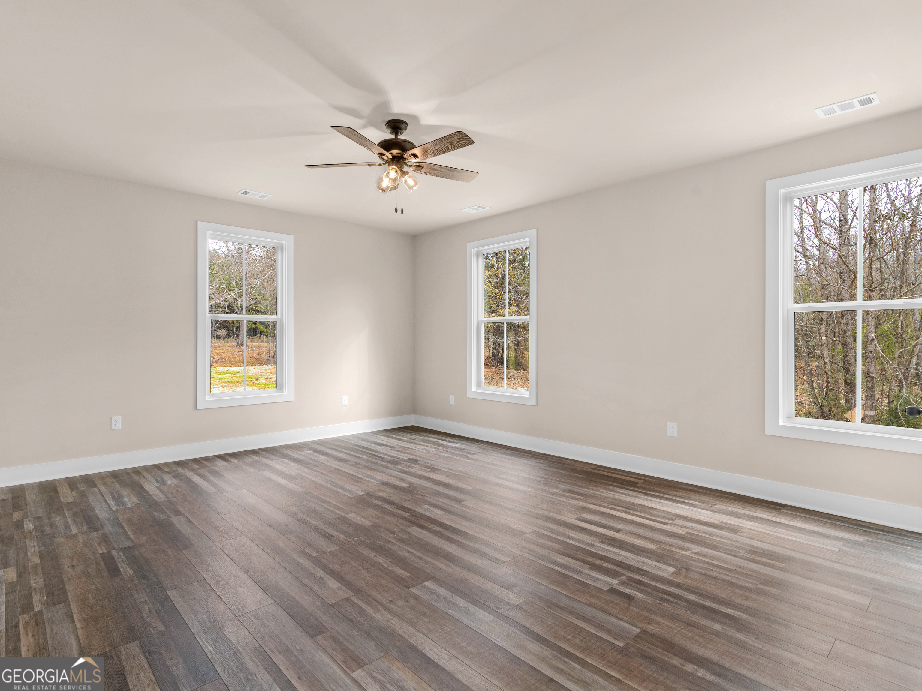 160 Loyd Road Mansfield, GA 30056 - Photo 41 of 53 a view of an empty room with wooden floor and a window