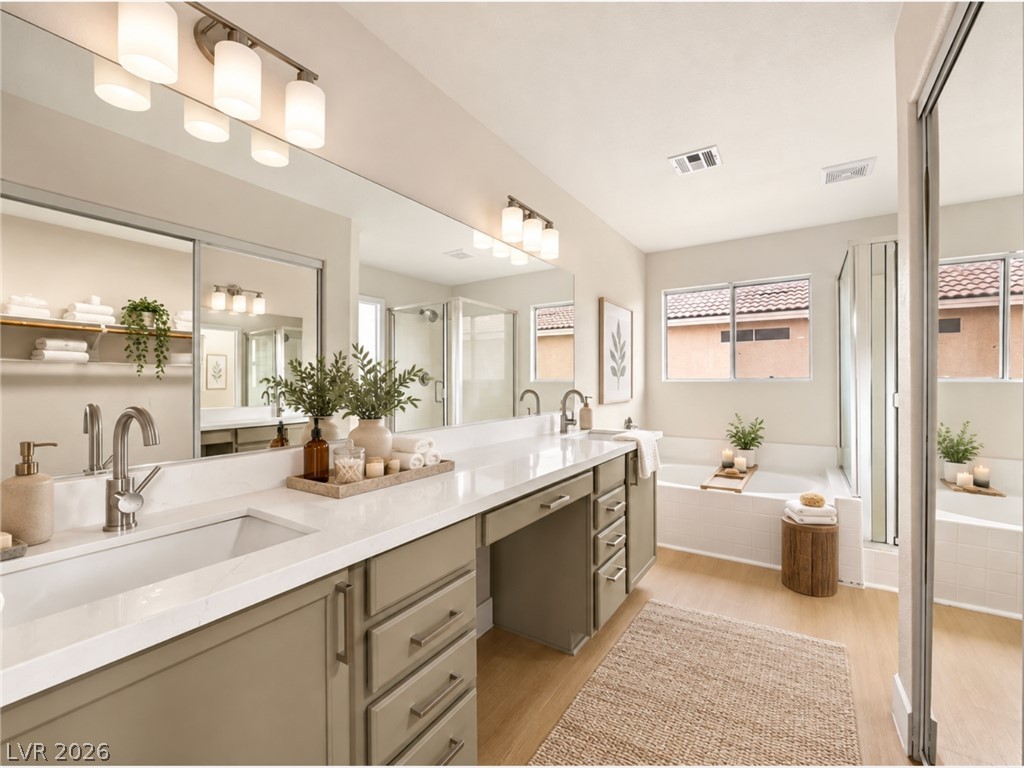 2650 Whisper Ridge Street Las Vegas, NV 89156 - Photo 2 of 28 Virtually Staged. A spacious bathroom displays a generous double vanity alongside a soaking tub and walk-in shower.
