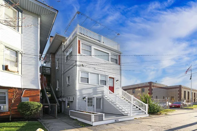 a view of a house with a street