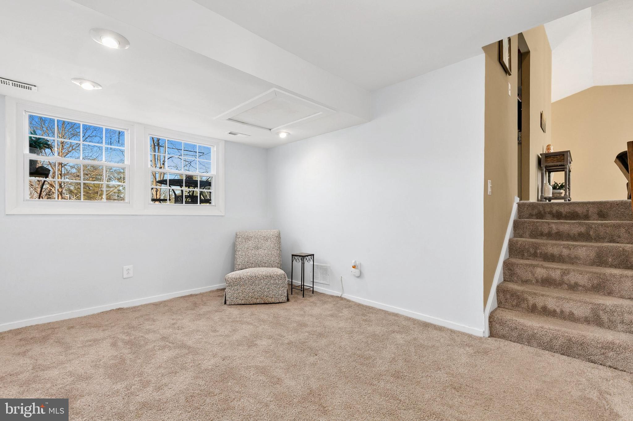 9348 Windbell Way Columbia, MD 21045 - Photo 20 of 37 a view of room with stairs and a window