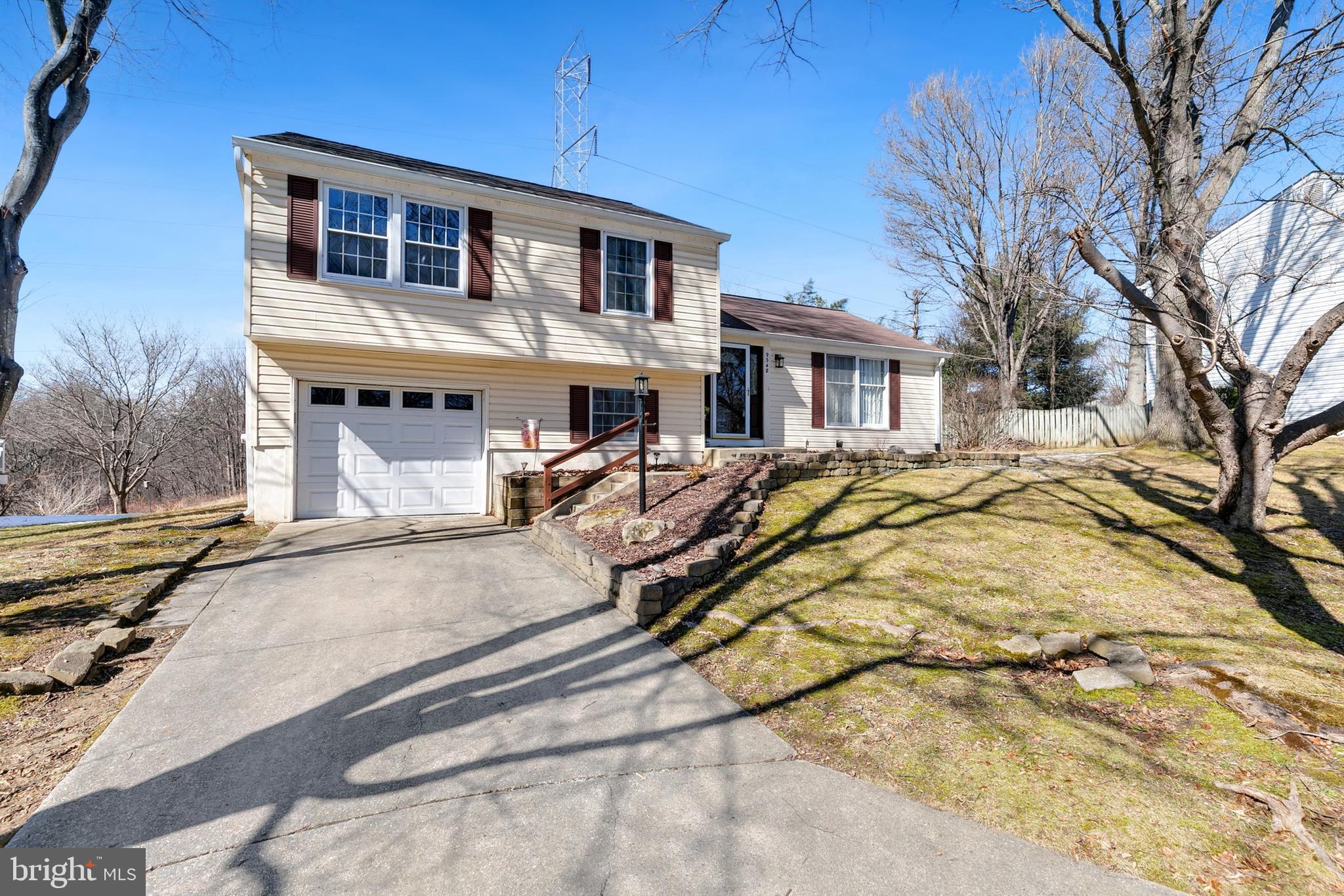 9348 Windbell Way Columbia, MD 21045 - Photo 2 of 37 a house view with a outdoor space