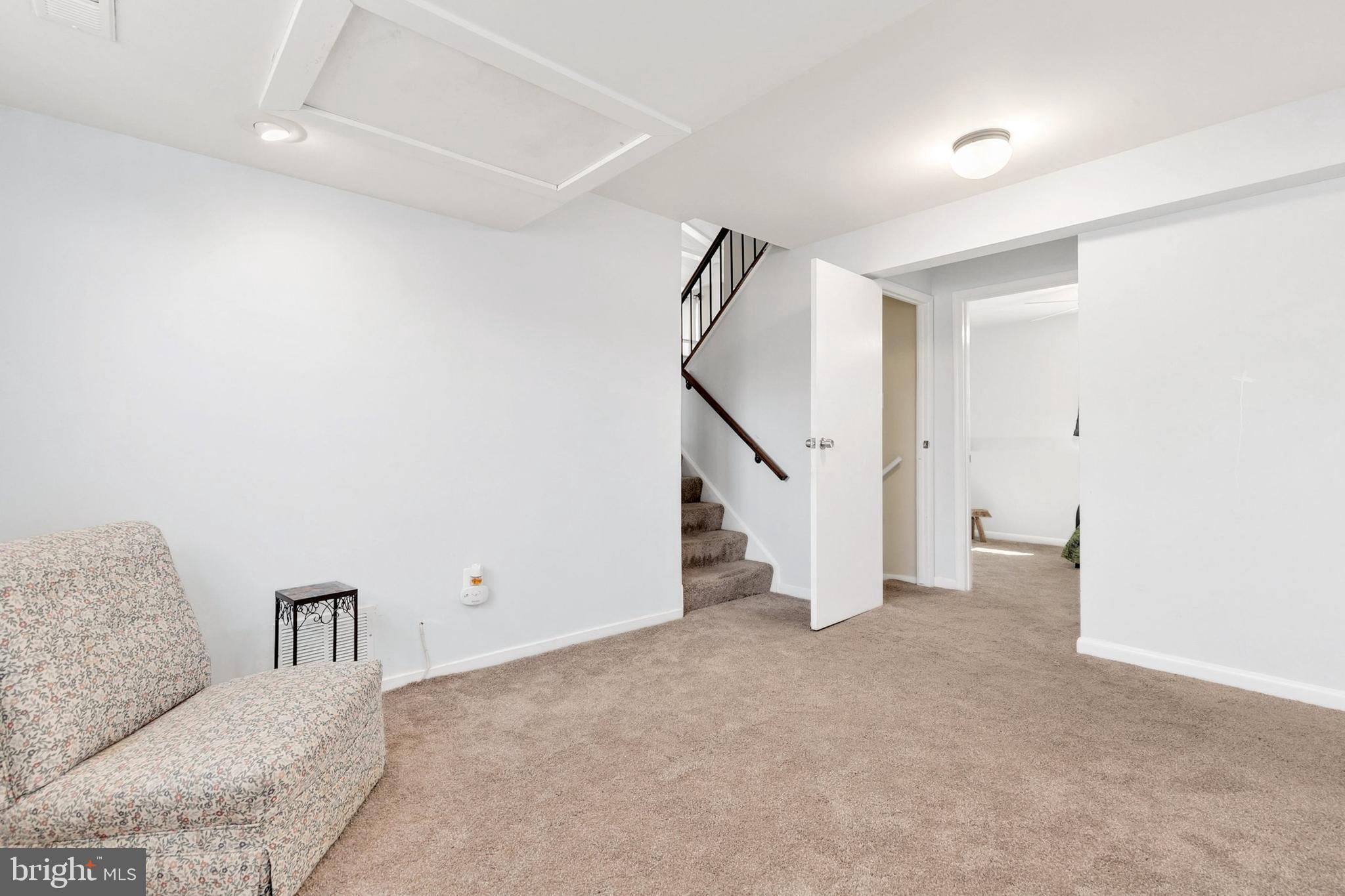 9348 Windbell Way Columbia, MD 21045 - Photo 22 of 37 a view of an empty room with stairs