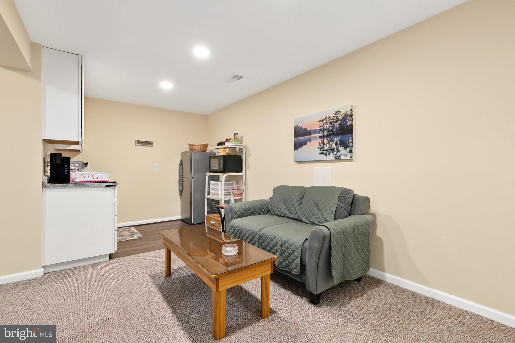 9348 Windbell Way Columbia, MD 21045 - Photo 25 of 37 a living room with furniture and a flat screen tv