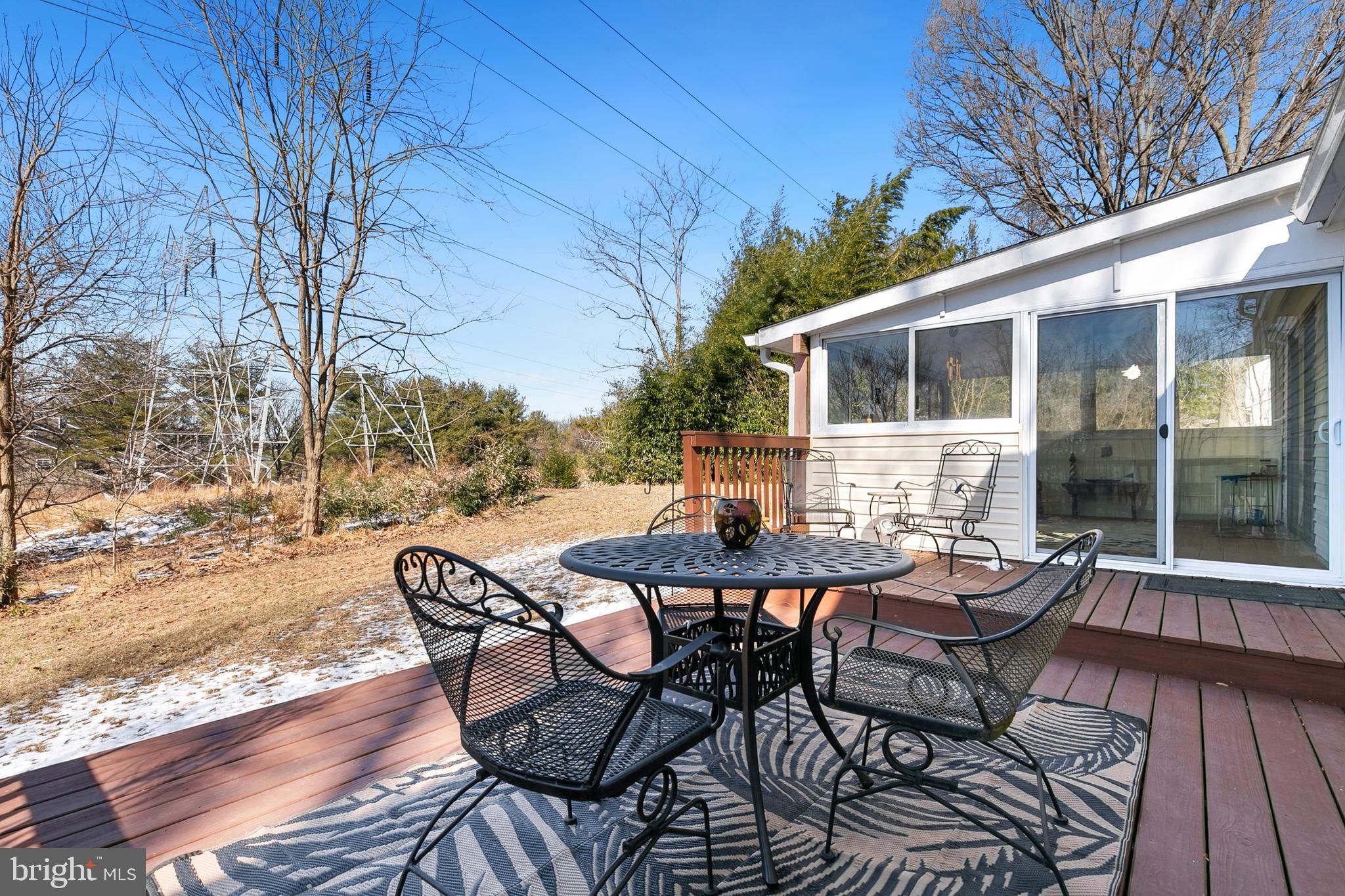 9348 Windbell Way Columbia, MD 21045 - Photo 31 of 37 a view of a patio with a table and chairs