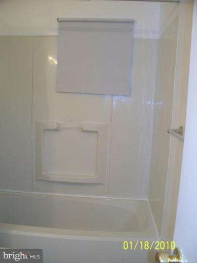 3928 Rolling Rd., Unit C3 Pikesville, MD 21208 - Photo 12 of 16 a bathroom with a bathtub
