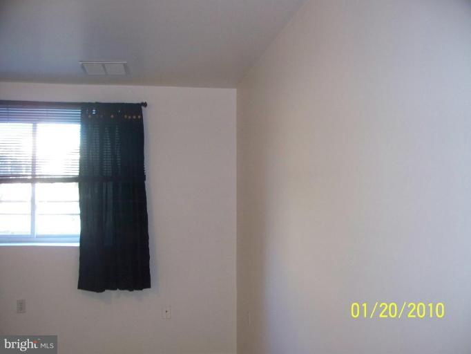 3928 Rolling Rd., Unit C3 Pikesville, MD 21208 - Photo 16 of 16 an empty room with a window