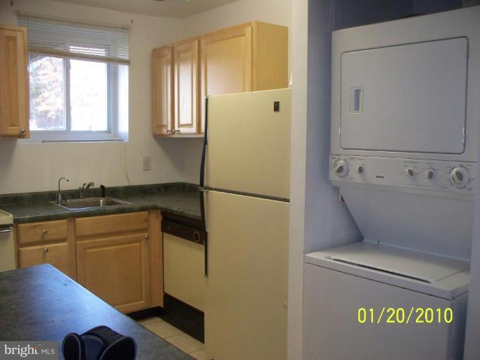 3928 Rolling Rd., Unit C3 Pikesville, MD 21208 - Photo 6 of 16 a kitchen with a refrigerator and sink